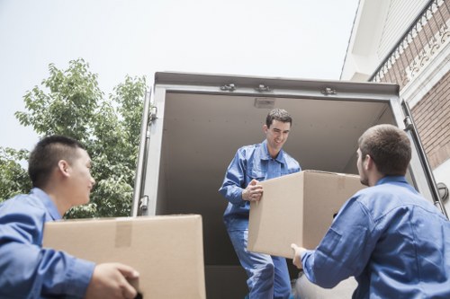Removal team loading furniture for a home move in Beddington