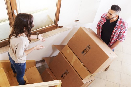 Loading household boxes into a removals van for a Beddington move