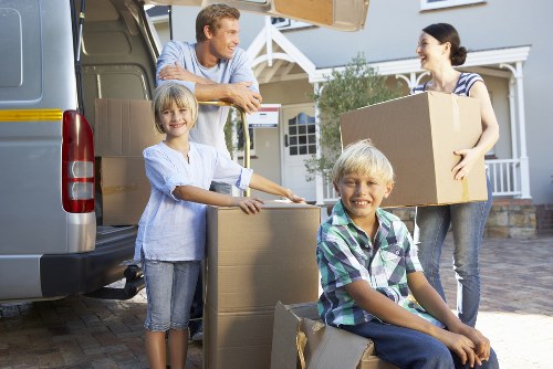 Prepared boxes and furniture ready for a moving van in Beddington