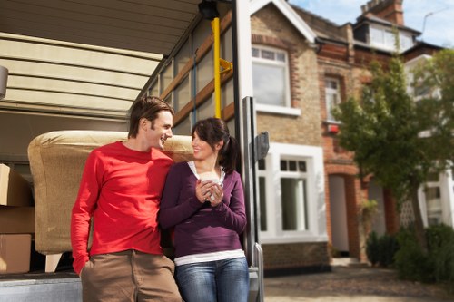 Local movers handling furniture in a Beddington property
